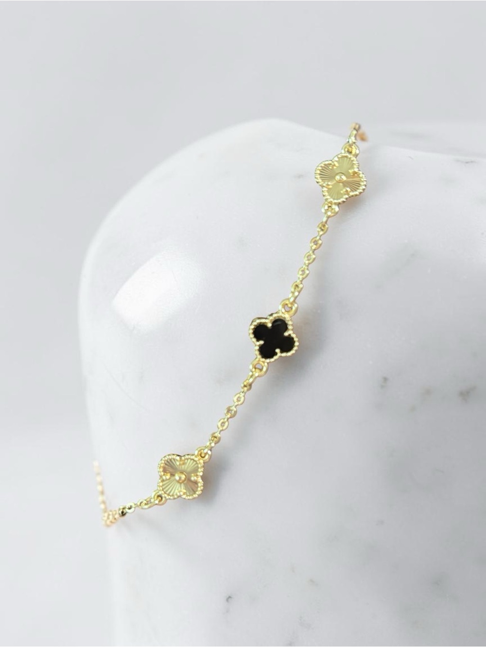 Gold Clover Link Bracelet with Black Accent